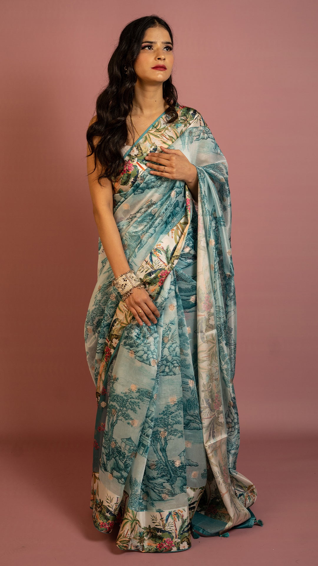 Aqua blue scenic printed designer saree with artistic landscape pattern and elegant drape