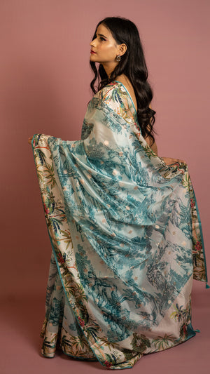 Aqua blue scenic printed designer saree with artistic landscape pattern and elegant drape