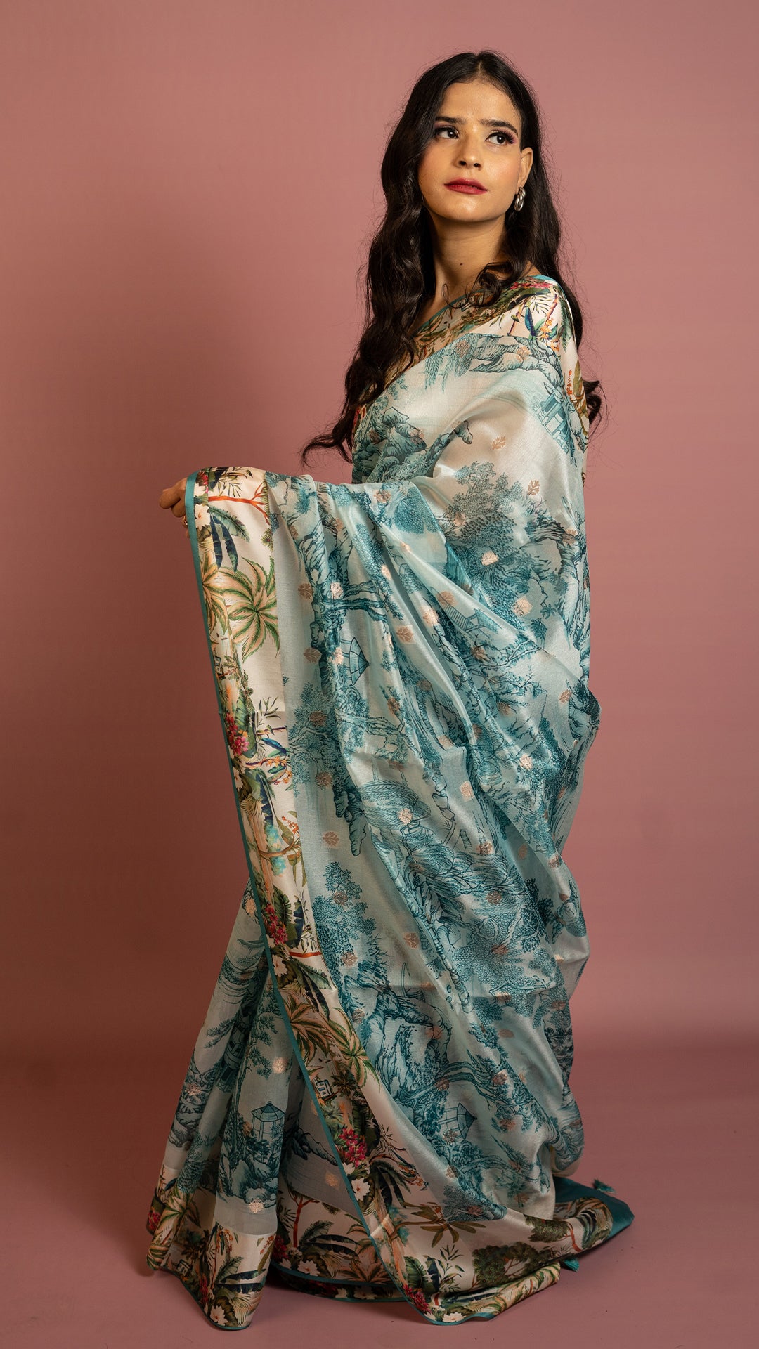 Aqua blue scenic printed designer saree with artistic landscape pattern and elegant drape