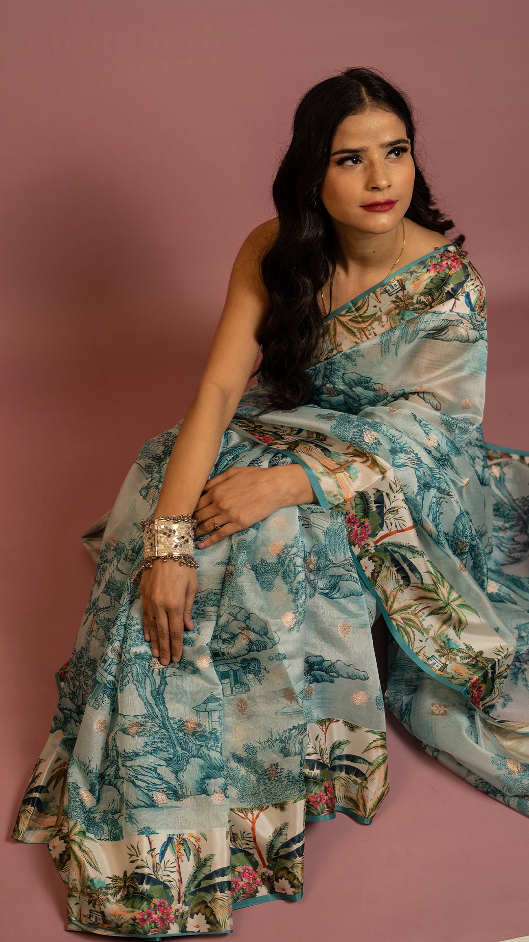 Aqua blue scenic printed designer saree with artistic landscape pattern and elegant drape