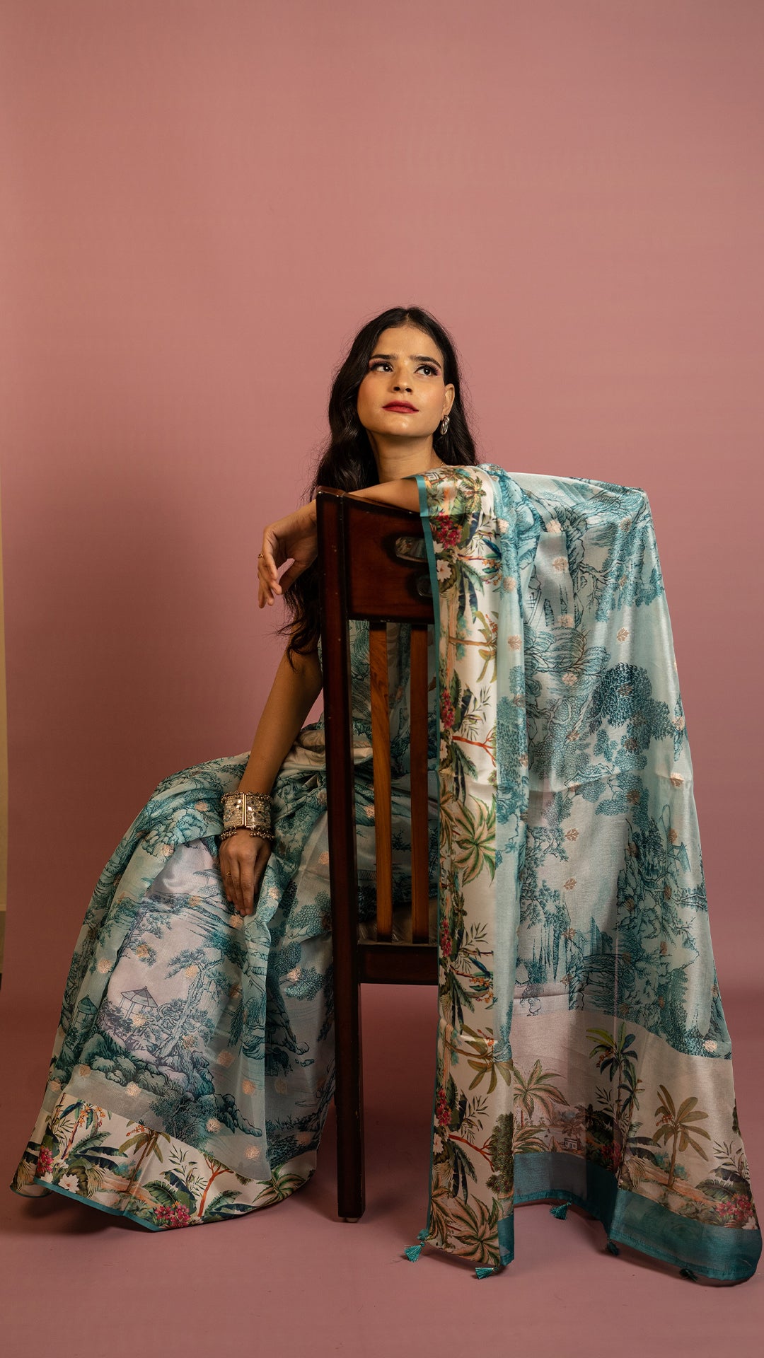 Aqua blue scenic printed designer saree with artistic landscape pattern and elegant drape