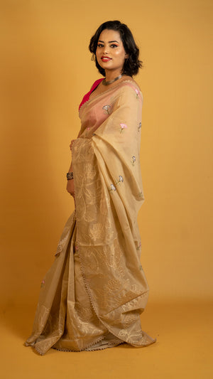 Beige organza saree with floral embroidery and elegant designer border