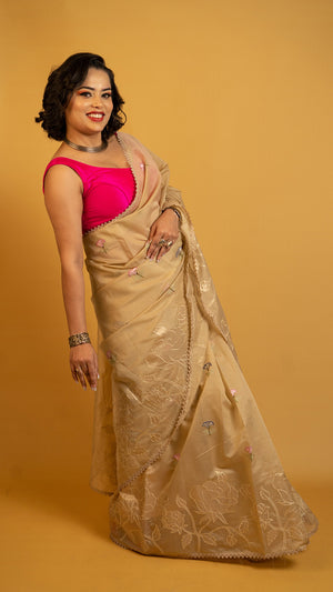 Beige organza saree with floral embroidery and elegant designer border