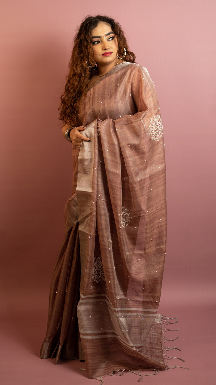 Brown lightweight saree with subtle embroidery and elegant traditional design