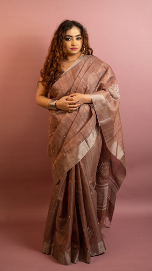 Brown lightweight saree with subtle embroidery and elegant traditional design