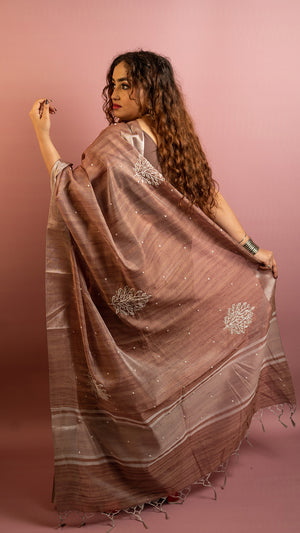 Brown lightweight saree with subtle embroidery and elegant traditional design