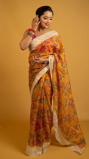Mustard floral printed Kota tissue saree with lace border, lightweight and breathable saree for daily and festive wear