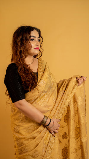 Mustard gold organza saree with floral embroidery and designer border for festive wear