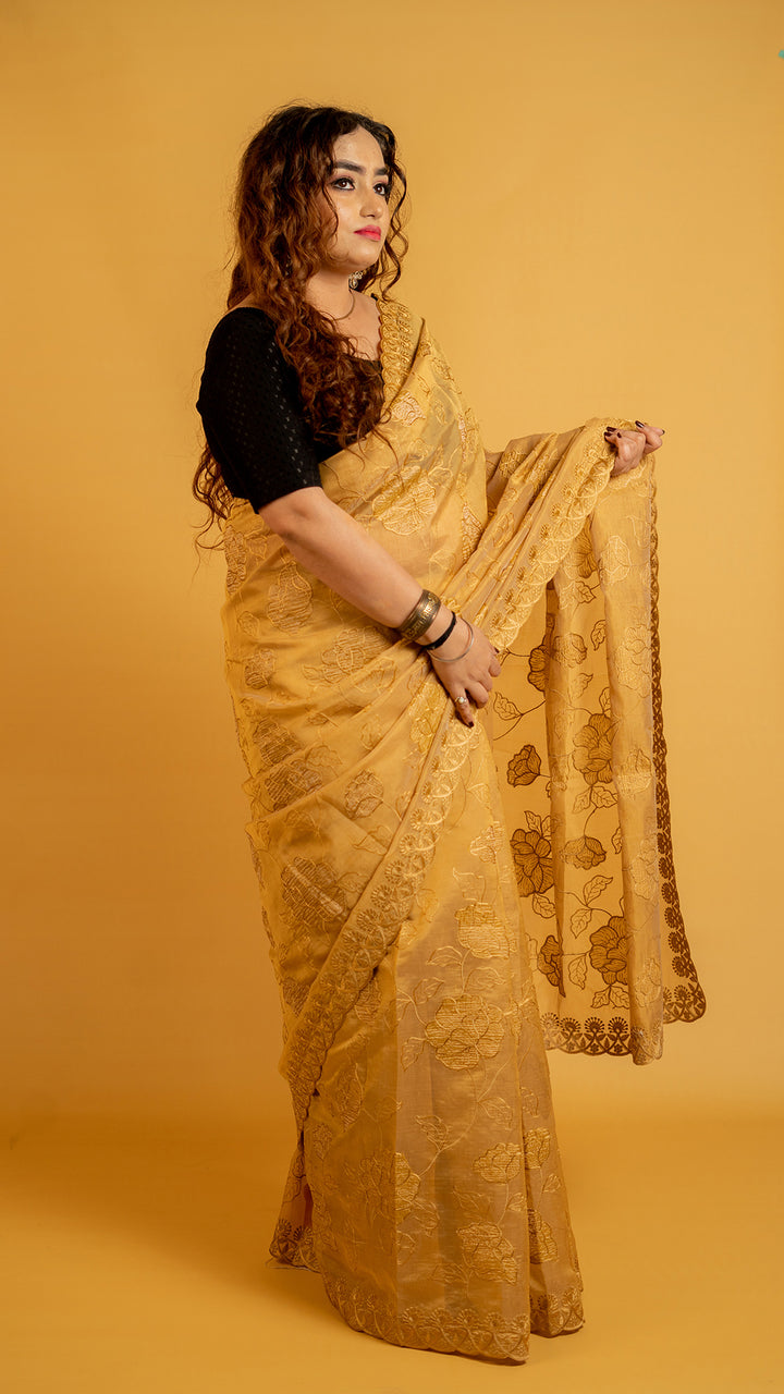 Mustard gold organza saree with floral embroidery and designer border for festive wear