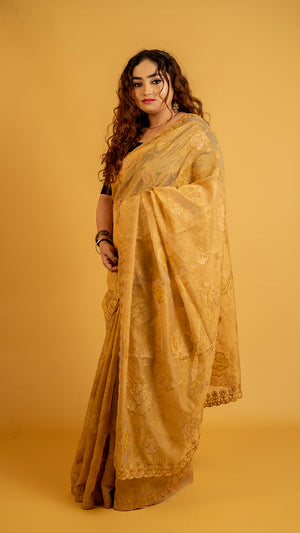 Mustard gold organza saree with floral embroidery and designer border for festive wear