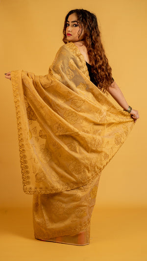 Mustard gold organza saree with floral embroidery and designer border for festive wear