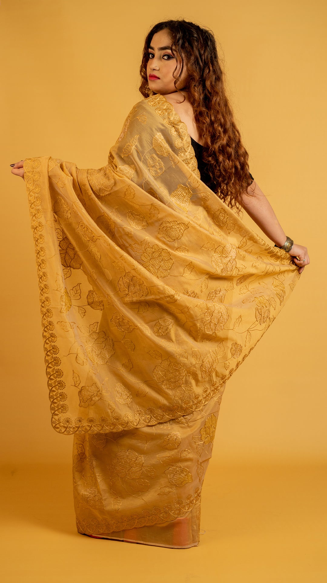 Mustard gold organza saree with floral embroidery and designer border for festive wear