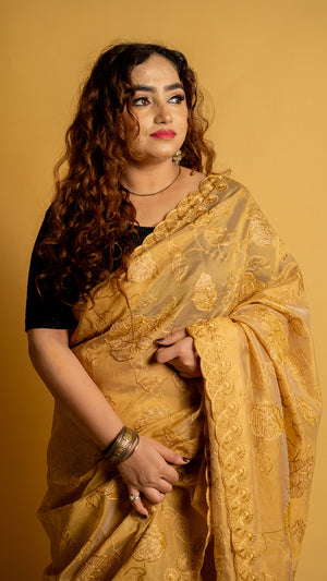 Mustard gold organza saree with floral embroidery and designer border for festive wear