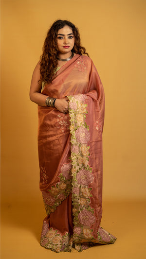 Peach organza silk saree with heavy floral embroidered border and elegant design