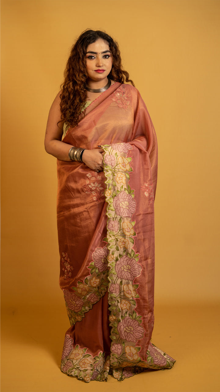 Peach organza silk saree with heavy floral embroidered border and elegant design