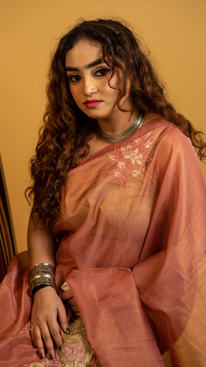 Peach organza silk saree with heavy floral embroidered border and elegant design