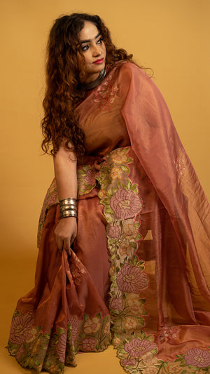 Peach organza silk saree with heavy floral embroidered border and elegant design