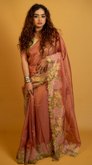 Peach organza silk saree with heavy floral embroidered border and elegant design