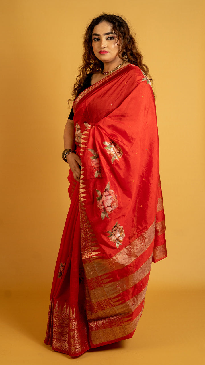 Red silk saree with zari border and floral motifs for wedding and festive wear