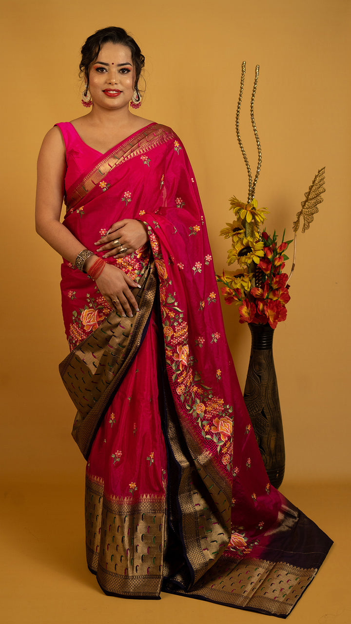 Royal red embroidered saree with antique gold zari border and floral design, perfect for wedding and festive wear