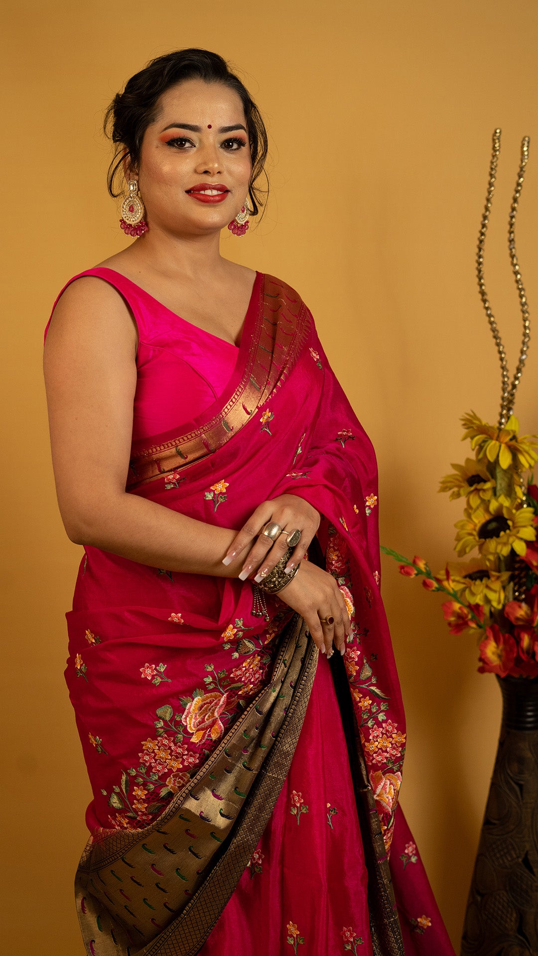 Royal red embroidered saree with antique gold zari border and floral design, perfect for wedding and festive wear
