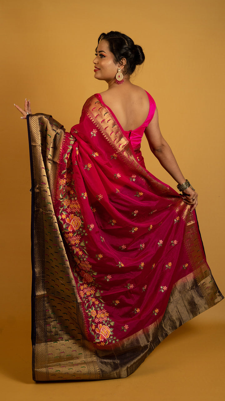 Royal red embroidered saree with antique gold zari border and floral design, perfect for wedding and festive wear
