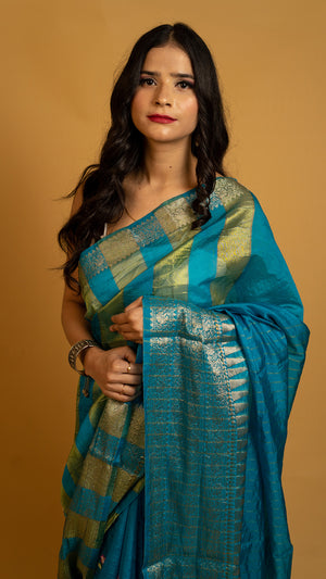 Teal blue silk saree with gold zari border and traditional woven design