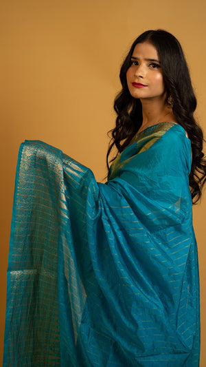 Teal blue silk saree with gold zari border and traditional woven design